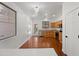 Eat-in kitchen with wood cabinets, stainless steel appliances, and wood floors at 8745 W Windsor Dr, Peoria, AZ 85381