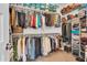 Spacious walk-in closet with ample hanging space and shelving for organized storage at 9343 W Atlantis Way, Tolleson, AZ 85353