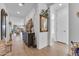 Inviting entryway showcasing neutral tones, tile flooring, decorative accents, and seamless access to various living spaces at 9343 W Atlantis Way, Tolleson, AZ 85353