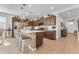 Stylish kitchen with a center island, stainless steel appliances, and abundant cabinet space, ideal for cooking and gathering at 9343 W Atlantis Way, Tolleson, AZ 85353
