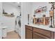 Well-organized laundry room with storage cabinets and essential appliances at 9343 W Atlantis Way, Tolleson, AZ 85353