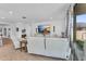 Bright living room with white walls, wood-look tile flooring, and modern decor at 9343 W Atlantis Way, Tolleson, AZ 85353