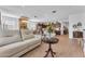 Spacious living area featuring an open floor plan, dining area, and modern furniture for comfortable living and entertaining at 9343 W Atlantis Way, Tolleson, AZ 85353