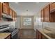 Updated kitchen with granite countertops, modern appliances, and ample cabinet space at 9625 W Mountain View Rd # A, Peoria, AZ 85345