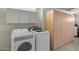 Laundry area with washer, dryer, and storage cabinets for convenience at 9625 W Mountain View Rd # A, Peoria, AZ 85345