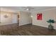 Spacious living room featuring wood flooring, a ceiling fan, and neutral paint colors at 9625 W Mountain View Rd # A, Peoria, AZ 85345