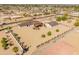 Aerial view of a desert home featuring a large lot, mature landscaping, detached garage and horse property at 11119 W Mountain View Rd, Sun City, AZ 85351