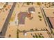 Aerial view showcases desert home with horse property, detached garage, mature landscaping and circular driveway at 11119 W Mountain View Rd, Sun City, AZ 85351