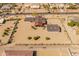 Aerial view showcases the property, featuring the home, detached garage, and surrounding desert landscape at 11119 W Mountain View Rd, Sun City, AZ 85351