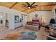 Stylized bedroom with barn door access and wood-paneled ceilings at 11119 W Mountain View Rd, Sun City, AZ 85351