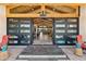 Inviting entrance with modern door, wood ceiling, and glimpses into the spacious living area at 11119 W Mountain View Rd, Sun City, AZ 85351
