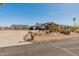 Beautiful desert home featuring a long driveway, mature landscaping, and desert style landscaping at 11119 W Mountain View Rd, Sun City, AZ 85351