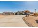 Beautiful desert home featuring a long driveway, mature landscaping, and desert style landscaping at 11119 W Mountain View Rd, Sun City, AZ 85351