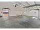 Large garage with multiple windows and a concrete floor provides ample space and natural light at 11119 W Mountain View Rd, Sun City, AZ 85351