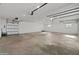 Expansive garage space featuring high ceilings and three garage doors, offering abundant parking at 11119 W Mountain View Rd, Sun City, AZ 85351