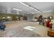 Spacious garage with carpeting and various furnishings, offering versatility and storage options at 11119 W Mountain View Rd, Sun City, AZ 85351