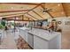 Modern kitchen with a large island, white countertops, and stainless steel appliances at 11119 W Mountain View Rd, Sun City, AZ 85351