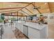Modern kitchen with white cabinets, quartz countertops, and stainless steel appliances in a bright, open space at 11119 W Mountain View Rd, Sun City, AZ 85351