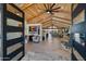 Spacious living room with vaulted wood ceilings, stylish furnishings, and an open floor plan at 11119 W Mountain View Rd, Sun City, AZ 85351