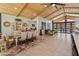 Bright living space with wood ceiling, tile floor, dining area, and comfortable seating, perfect for entertaining at 11119 W Mountain View Rd, Sun City, AZ 85351