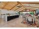 Bright, open living space featuring a modern kitchen, dining area, and sliding glass doors at 11119 W Mountain View Rd, Sun City, AZ 85351