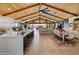 Bright, open living space featuring a modern kitchen, dining area, and sliding glass doors at 11119 W Mountain View Rd, Sun City, AZ 85351