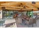 Covered outdoor patio with comfortable seating and open views at 11119 W Mountain View Rd, Sun City, AZ 85351