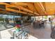 View from patio to indoor space and to outdoor space with ample seating at 11119 W Mountain View Rd, Sun City, AZ 85351