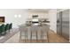 The open kitchen features a granite countertop island and stainless steel appliances at 1201 N 13Th St, Coolidge, AZ 85128