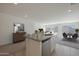 Open kitchen with granite countertops and stainless steel appliances overlooks living area at 1201 N 13Th St, Coolidge, AZ 85128