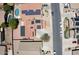 Aerial view of homes with solar panels and a refreshing blue pool enhancing this suburban neighborhood at 16215 W Durango St, Goodyear, AZ 85338