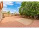 Large backyard with desert landscaping and a block wall at 16215 W Durango St, Goodyear, AZ 85338