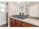 Bathroom vanity with vessel sink, wood cabinets, and modern fixtures at 16215 W Durango St, Goodyear, AZ 85338
