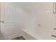 Clean bathroom featuring a white bathtub, shower, and access door at 16215 W Durango St, Goodyear, AZ 85338