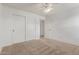 Bedroom featuring a closet with sliding doors and neutral carpeting at 16215 W Durango St, Goodyear, AZ 85338
