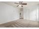 Bedroom featuring neutral carpeting and a closet with sliding doors at 16215 W Durango St, Goodyear, AZ 85338