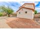 Side exterior view with a decorative rock landscaping at 16215 W Durango St, Goodyear, AZ 85338