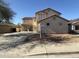 Exterior front of a two-story home with a three-car garage at 16215 W Durango St, Goodyear, AZ 85338