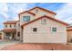 Side exterior view with a decorative rock landscaping at 16215 W Durango St, Goodyear, AZ 85338