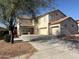 Exterior front of a two-story home with a three-car garage at 16215 W Durango St, Goodyear, AZ 85338