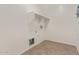 This laundry room is spacious and has tile floor and upper cabinets at 16215 W Durango St, Goodyear, AZ 85338