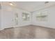 Bright living room with beautiful wood flooring and a window at 16215 W Durango St, Goodyear, AZ 85338