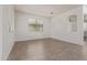 Bright living room with beautiful wood flooring and a window at 16215 W Durango St, Goodyear, AZ 85338