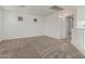 Open loft area featuring neutral carpet, natural light and white walls at 16215 W Durango St, Goodyear, AZ 85338