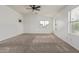 Spacious main bedroom with vaulted ceilings, plush carpet and natural light at 16215 W Durango St, Goodyear, AZ 85338