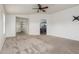 Large main bedroom boasts plush carpet, neutral walls, and ample space at 16215 W Durango St, Goodyear, AZ 85338