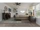Comfortable main bedroom with ceiling fan, and a large window that allows lots of natural light at 16215 W Durango St, Goodyear, AZ 85338