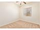 Neutral-toned bedroom featuring carpet flooring, a ceiling fan, and window with blinds at 16768 W Nottingham Way, Surprise, AZ 85374