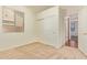 Cozy bedroom with closet and neutral carpet, filled with natural light from the window at 16768 W Nottingham Way, Surprise, AZ 85374