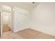 Cozy bedroom featuring carpet flooring, a closet, and a view into the hallway at 16768 W Nottingham Way, Surprise, AZ 85374